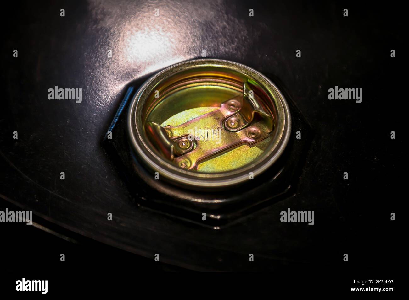 The closure of an old oil drum at a gas station. Stock Photo