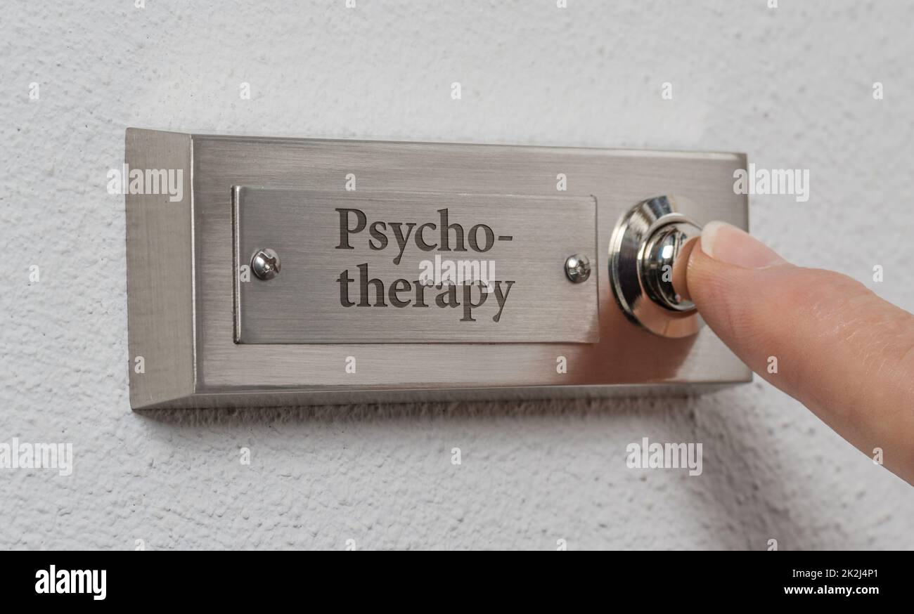 Doorbell sign with the engraving Psychotherapy Stock Photo