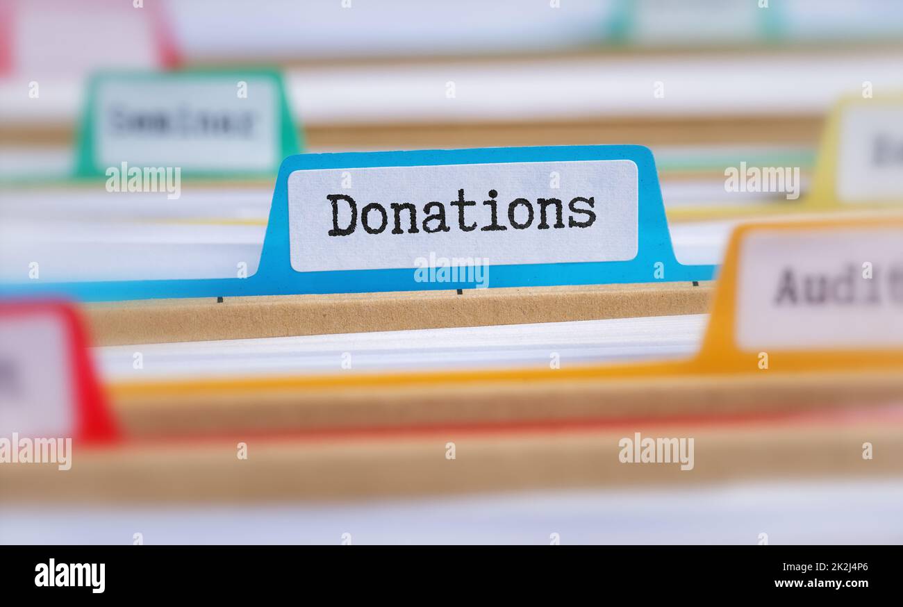 File folders with a tab labeled Donations Stock Photo