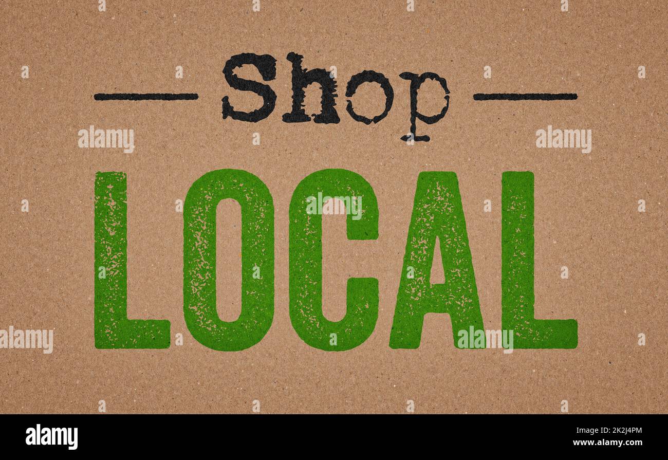 Shop local written on a retro paper background Stock Photo