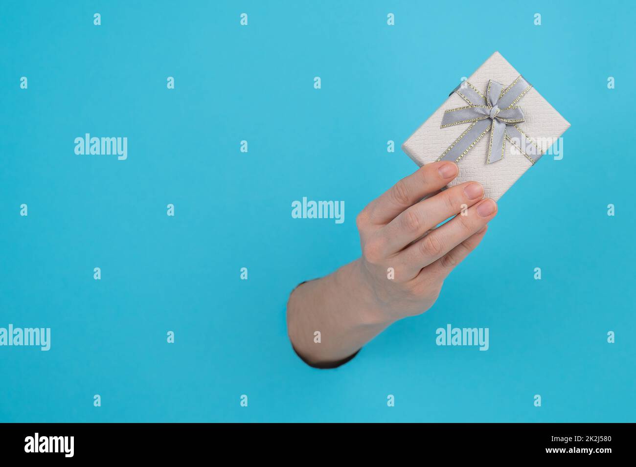 Hand sticking out of a cardboard box hi-res stock photography and ...
