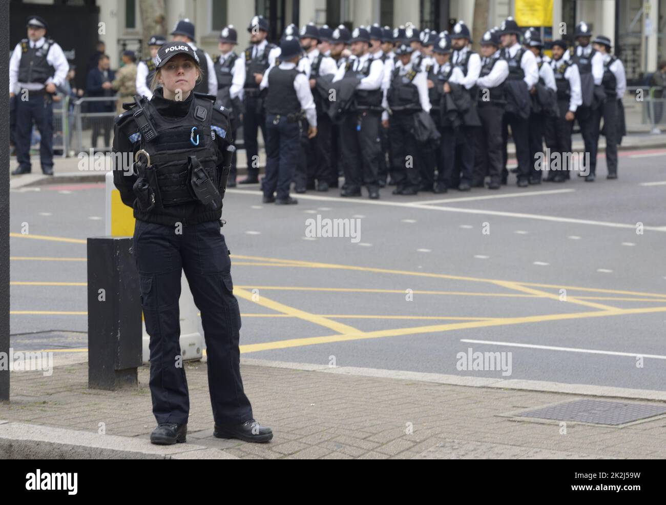 London, UK. The day of the State Funeral of Queen Elizabeth II. Police officers getting organised at the crossing of Queen's Gate and Cromwell Road. 1 Stock Photo