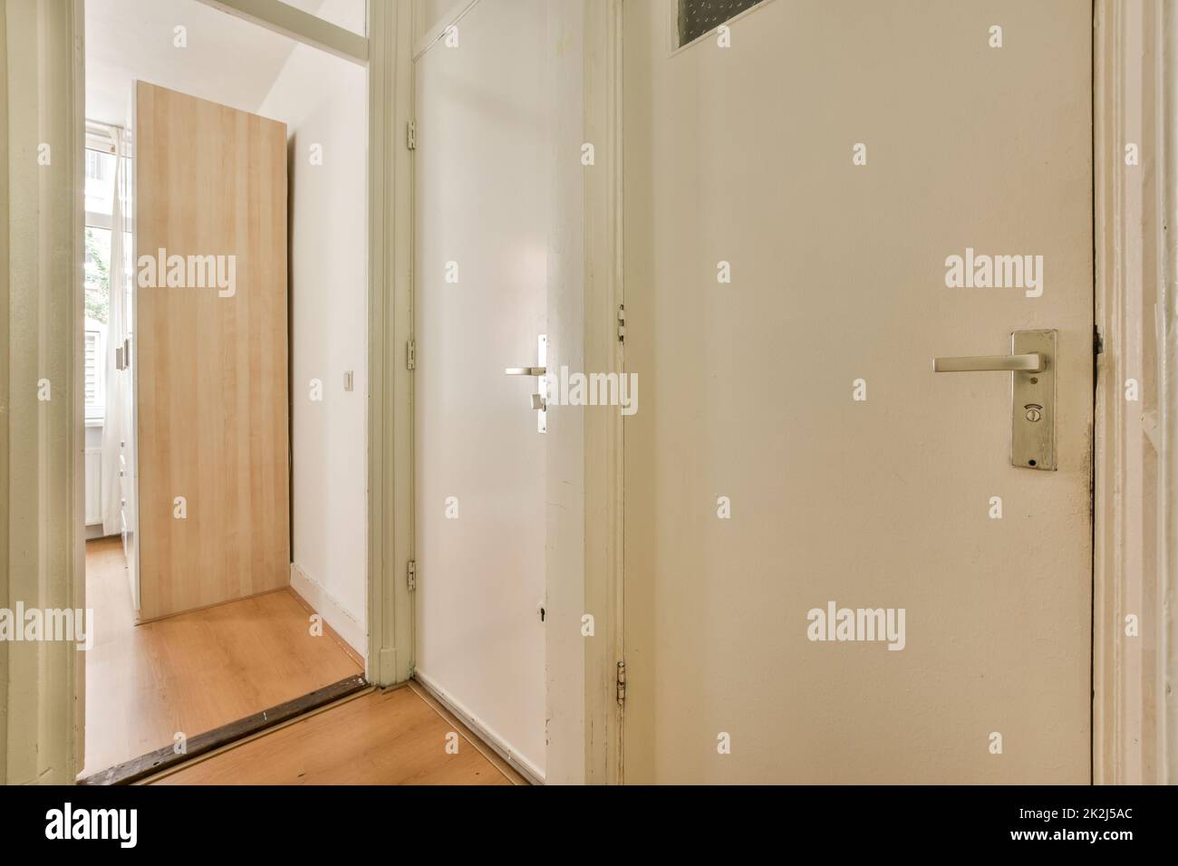 Small hallway with many doors Stock Photo Alamy