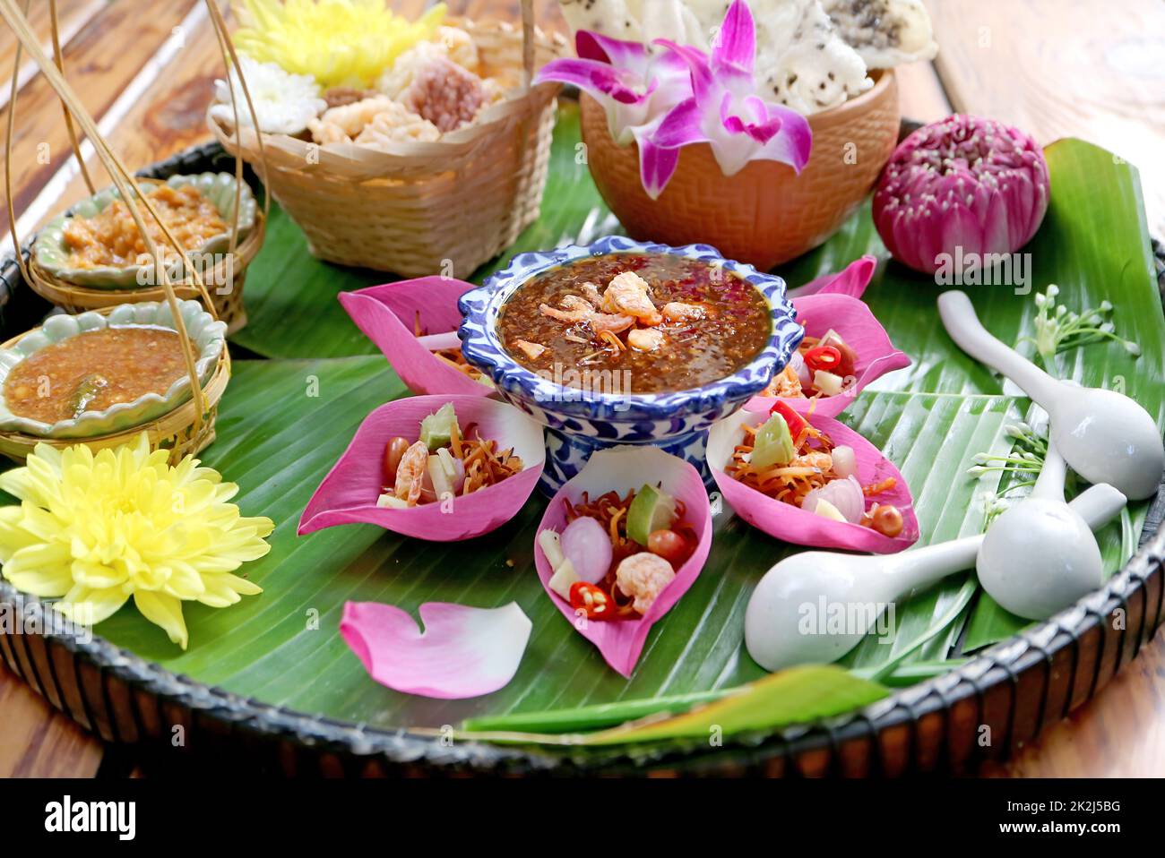 Mouthwatering Fresh Lotus Petal Savory Wrapped Called Miang kham in Thai Stock Photo