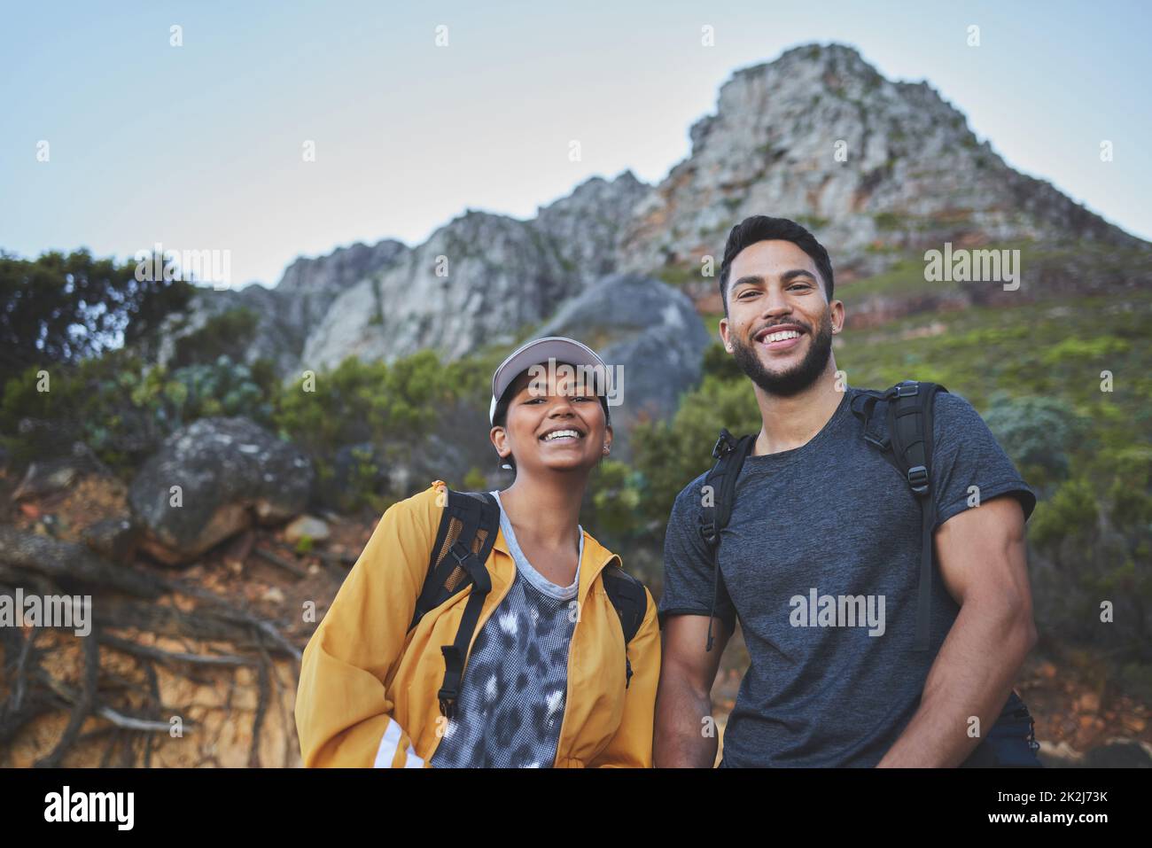 Two beautiful women hiking in nature on a mountain road Stock Photo - Alamy