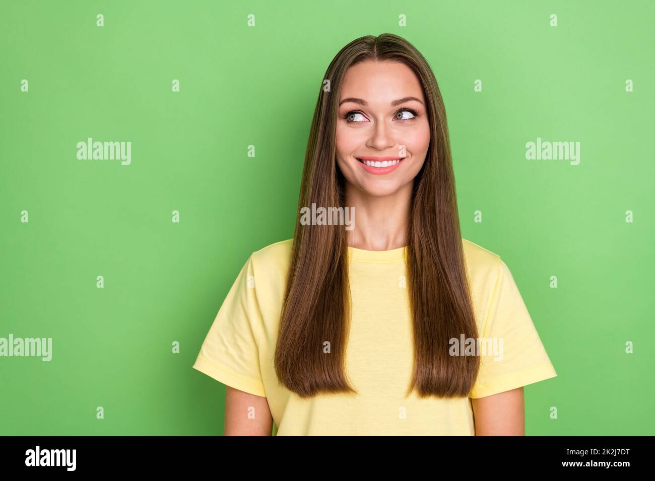 Photo of satisfied lovely lady dressed trendy outfit interested look empty space big black friday sales isolated on green color background Stock Photo
