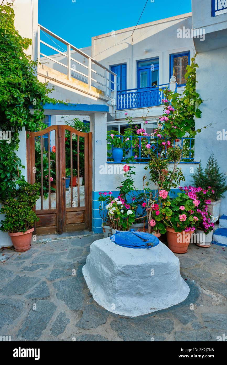 Greek village typical view with whitewashed houses and stairs. Plaka town, Milos island, Greece