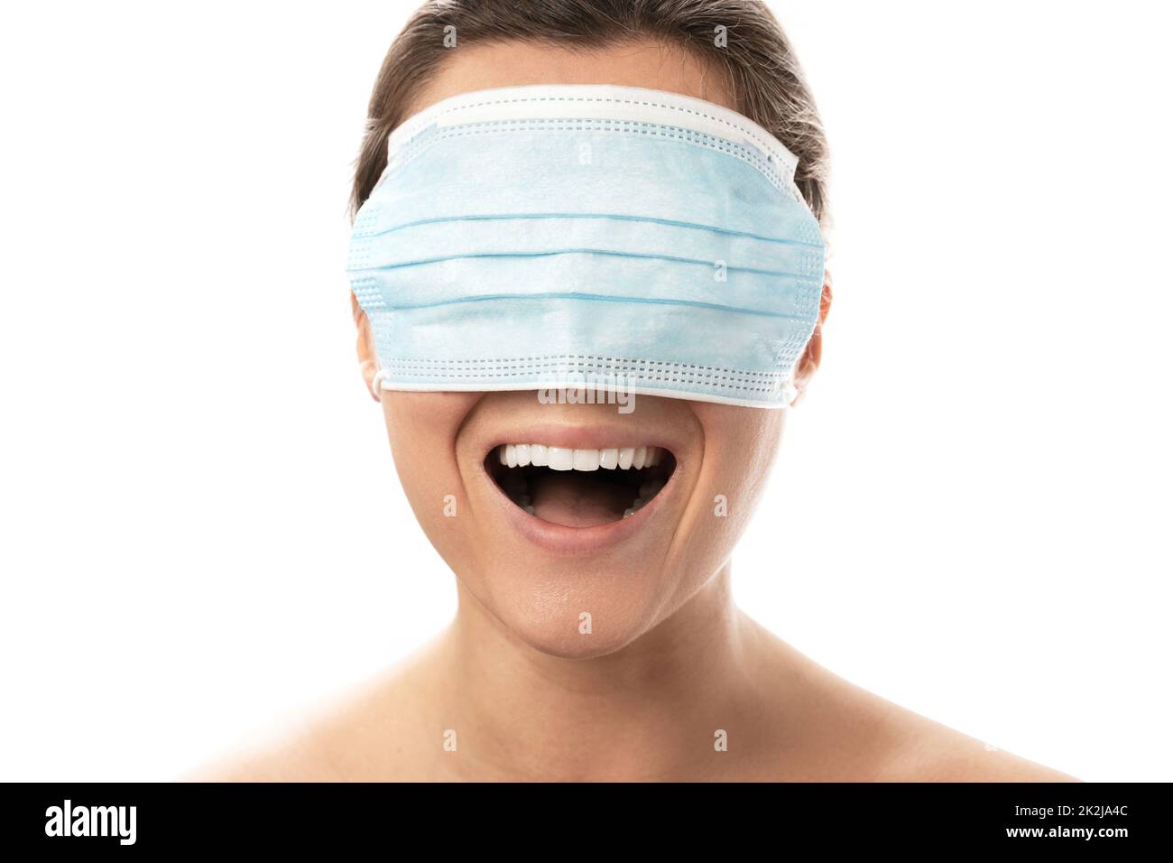 Happy smiling woman wearing mask over her eyes Stock Photo - Alamy