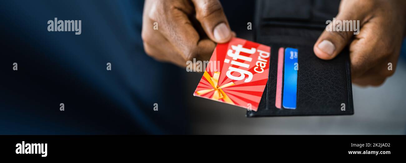 African Hand Holding Gift Card Voucher Stock Photo Alamy
