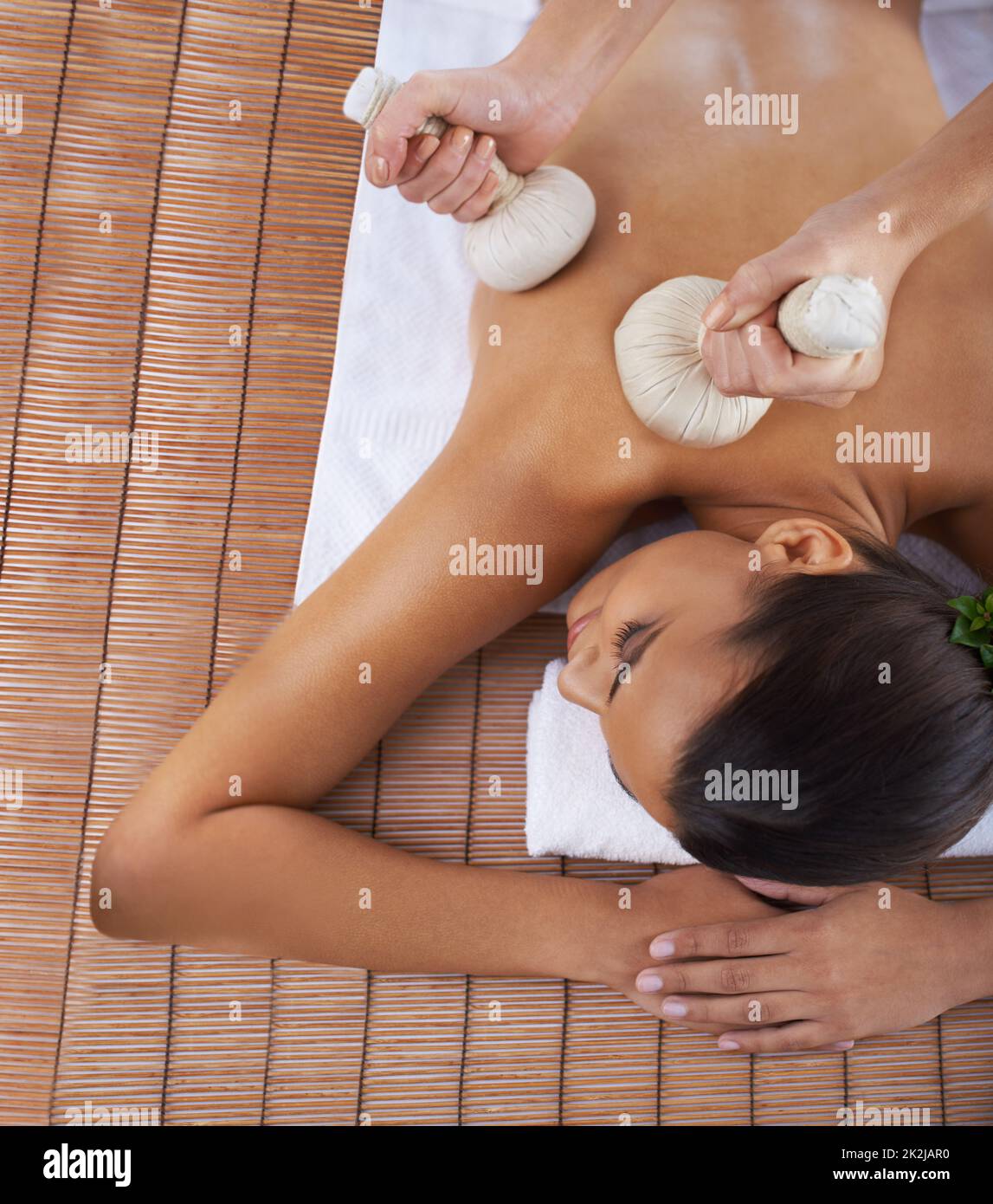 Enjoy a day of pampering. A young woman lying in a health spa. Stock Photo