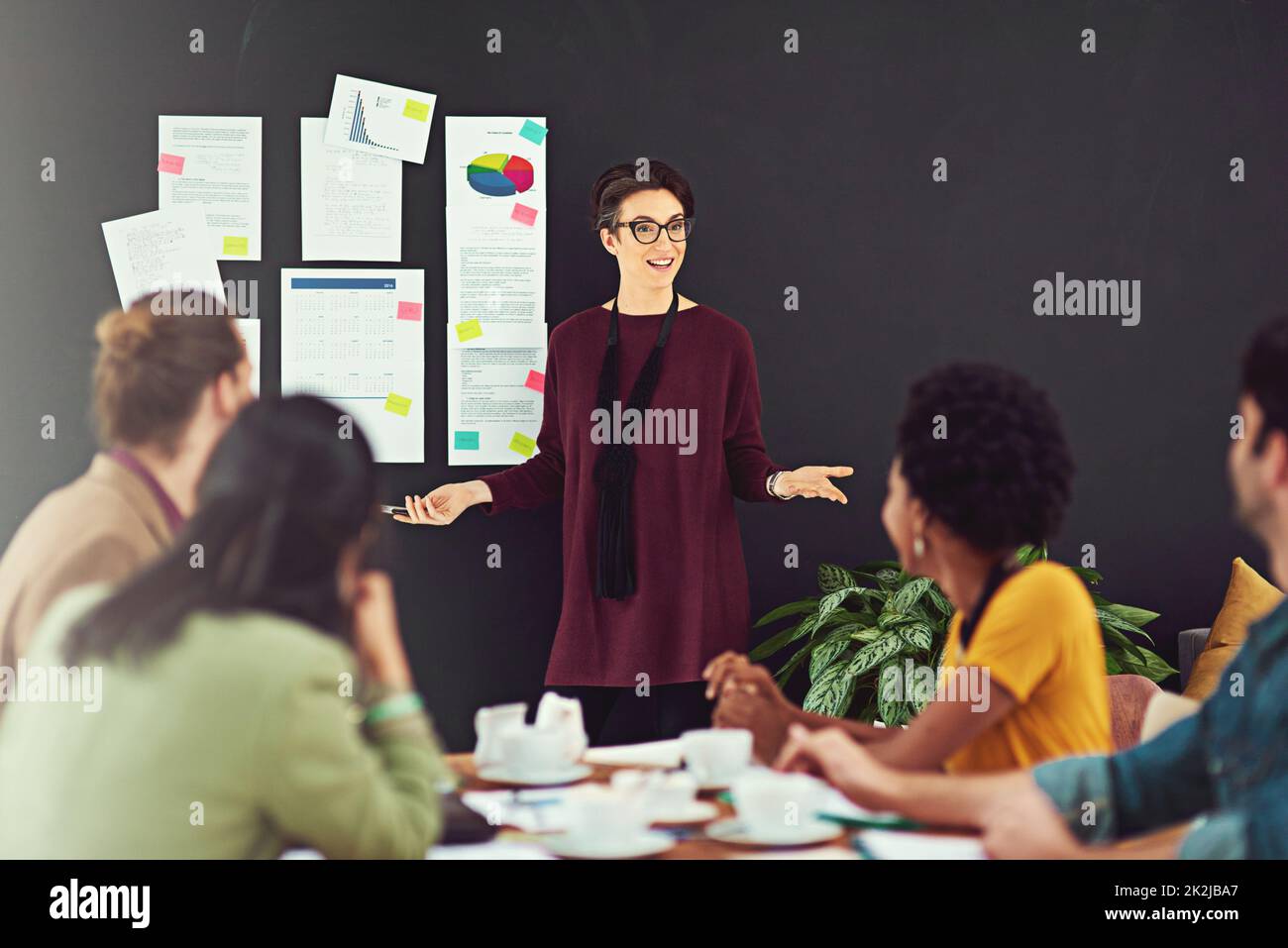 Impressing the team with her ideas. Cropped shot of a young creative giving a presentation to her colleagues in an office. Stock Photo