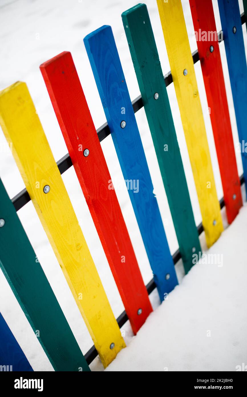 Colorful wooden fence on a white background. Stock Photo