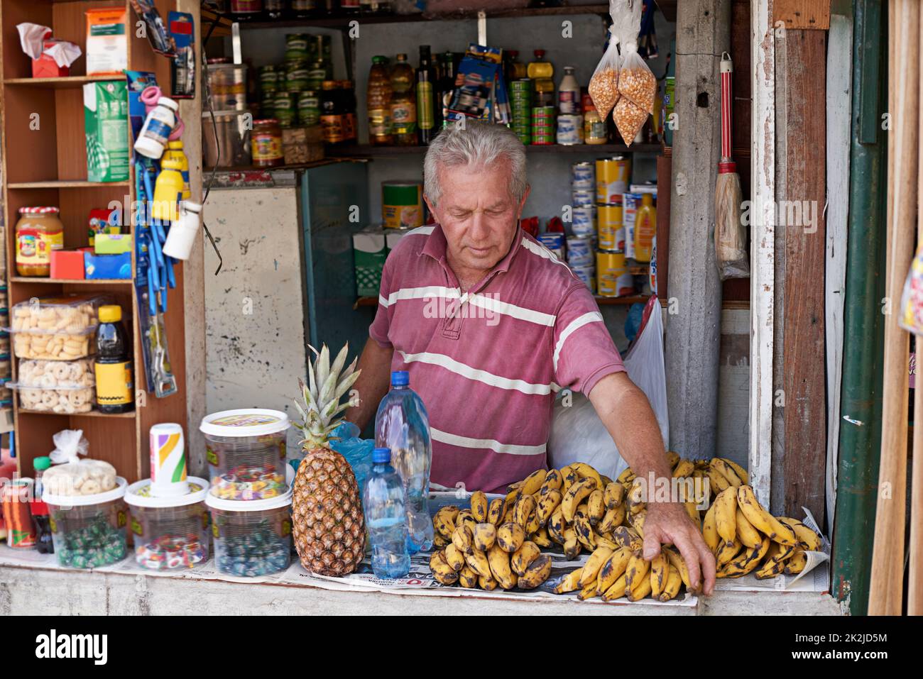 Street entrepreneur. Shot of a street vendor selling a variety of food