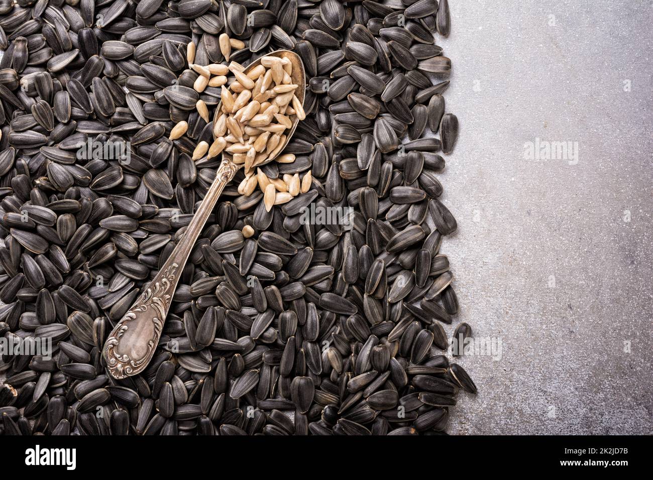 Top view of peeled and unpeeled sunflower seeds for healthy nutrition ...