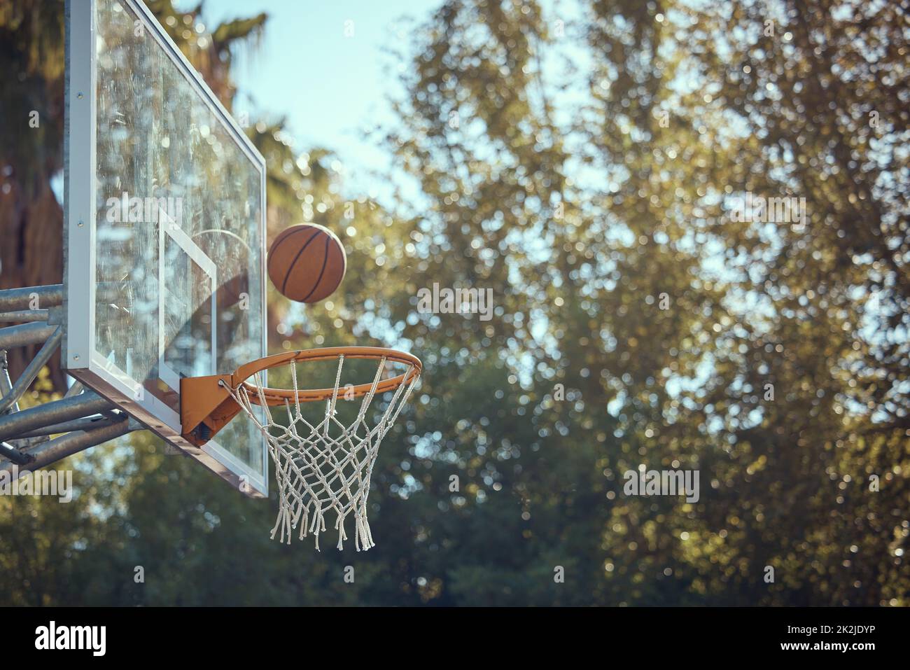 Basketball court net, point score and sports playing game, competition and action match outdoor