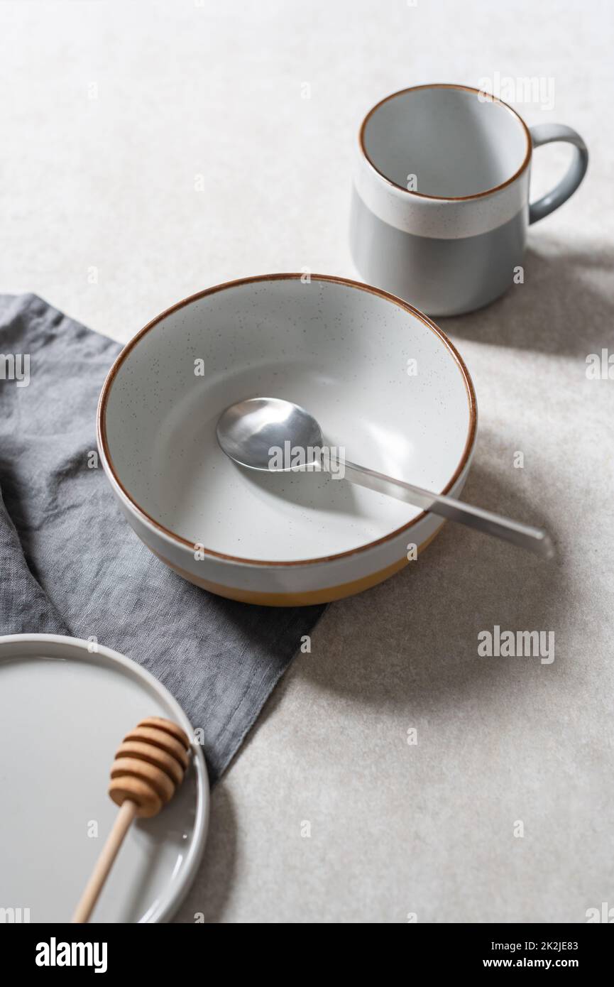 Empty plates on grey background Stock Photo