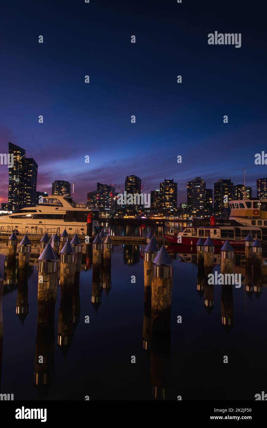 Old Pier Stumps at Melbourne's Docklands precinct, taken shortly after sunset, Melbourne, Australia - May 19, 2022 Stock Photo