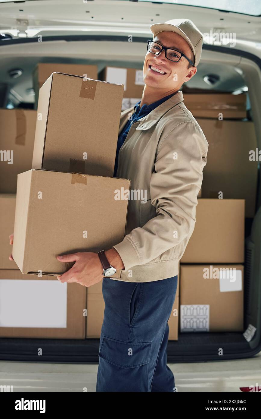 https://c8.alamy.com/comp/2K2JG6C/this-might-be-one-of-your-deliveries-portrait-of-a-courier-moving-boxes-in-a-delivery-van-2K2JG6C.jpg