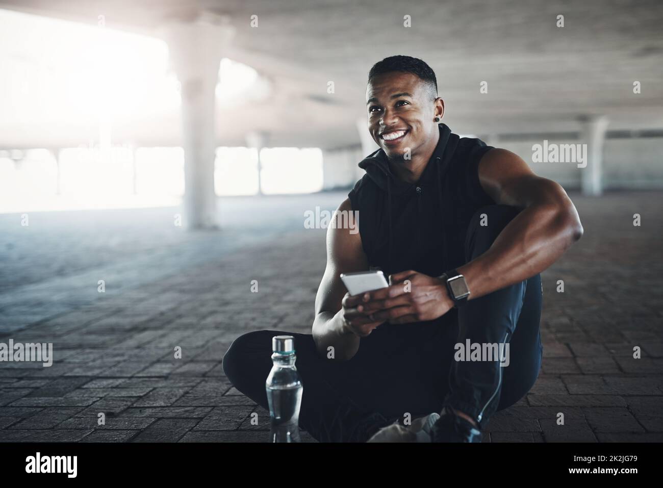 Post workout endorphins. Cropped shot of a handsome young man sending a