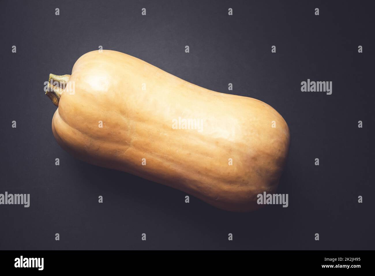Butternut squash isolated on black background Stock Photo