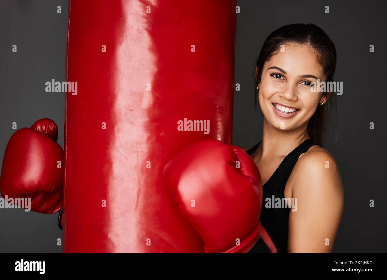 I love boxing. Cropped portrait of an attractive young female boxer training in the gym. Stock Photo