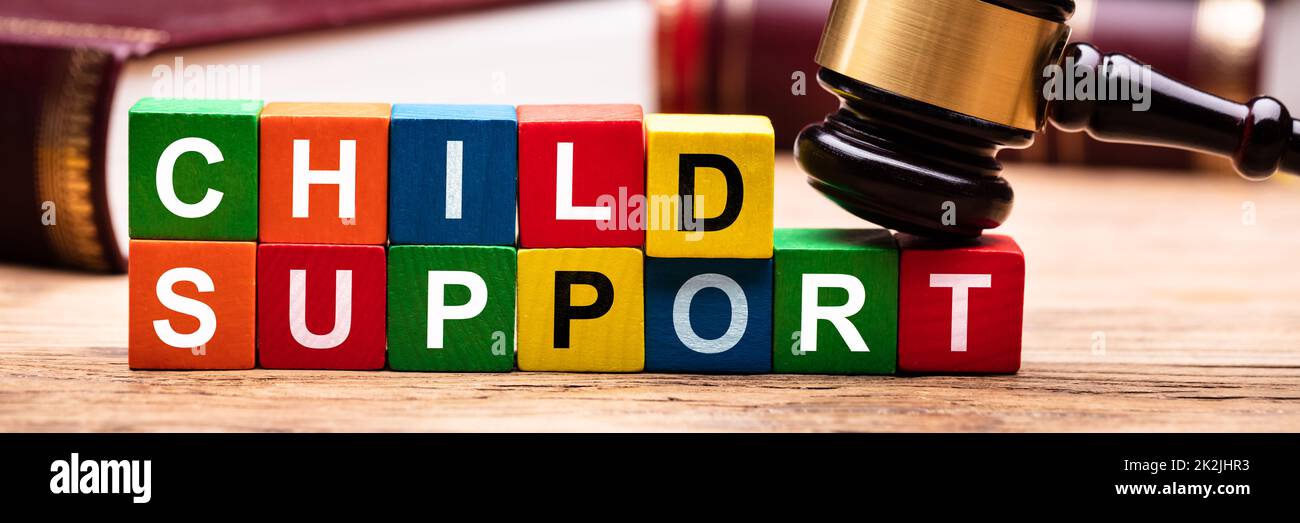 Child Support Block With Bible And Mallet Stock Photo
