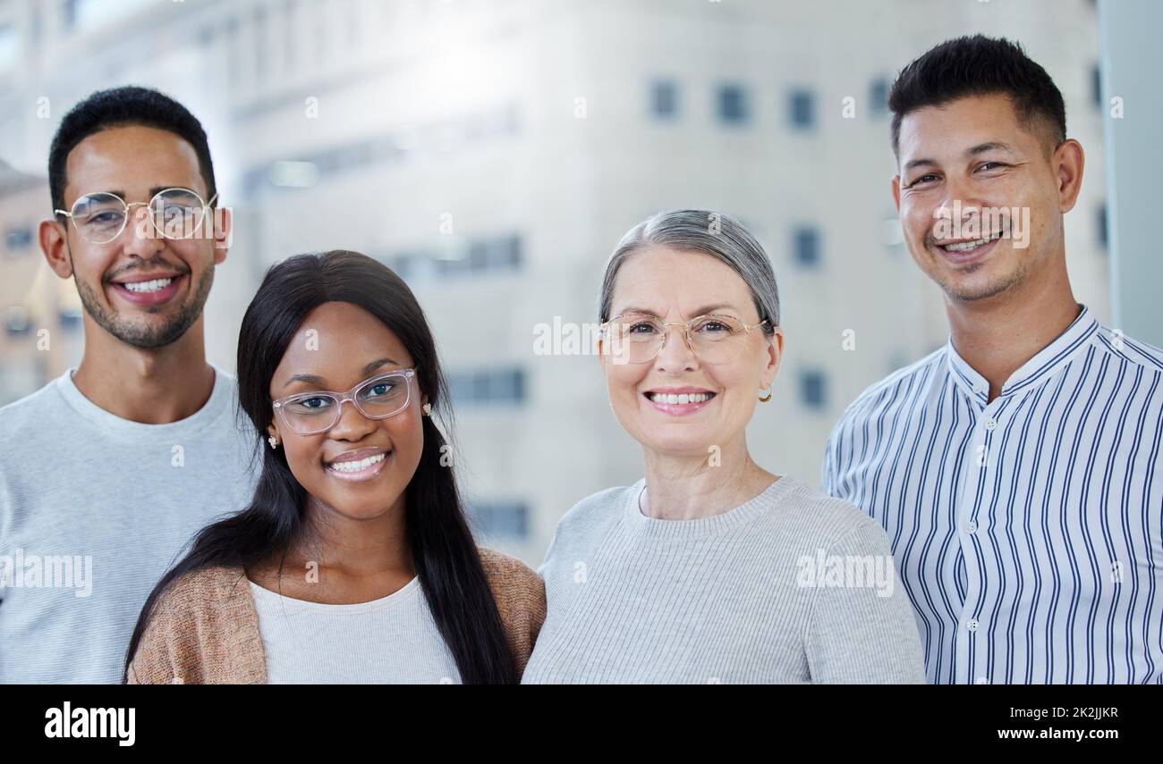 My staff deserve all the best. Shot of a diverse group of work colleagues together in their office. Stock Photo