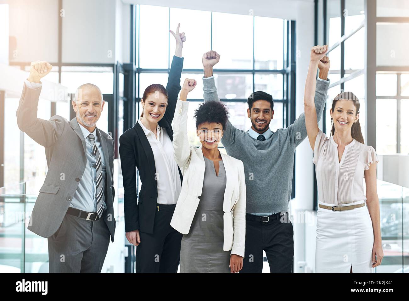 The persistent team is a profitable team. Portrait of a diverse team of colleagues cheering you on at work. Stock Photo