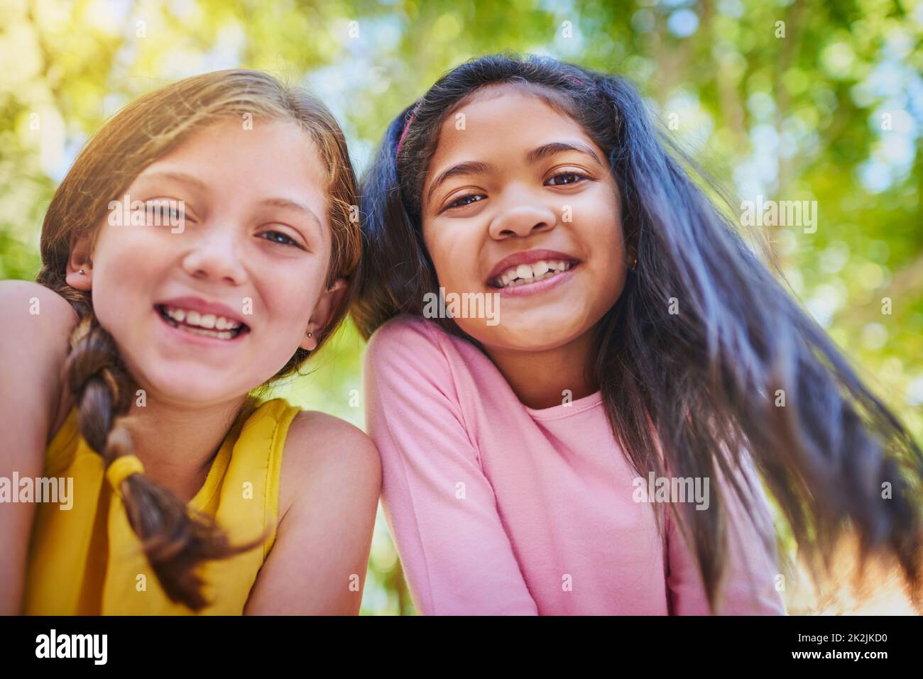 The best friend any girl could ask for. Shot of two adorable young girls outside. Stock Photo