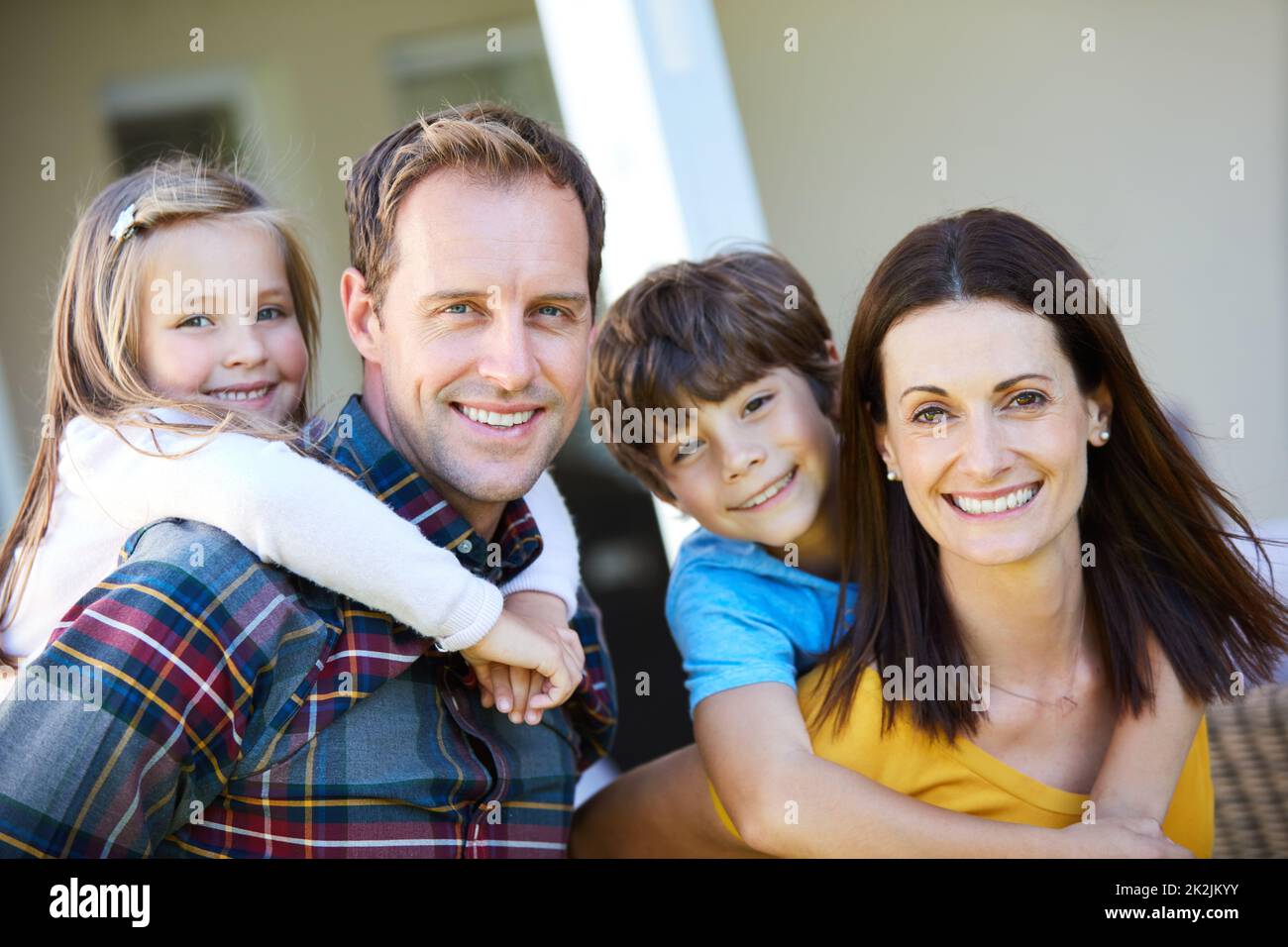 We have everything we need. Shot of a family of four spending time outdoors. Stock Photo