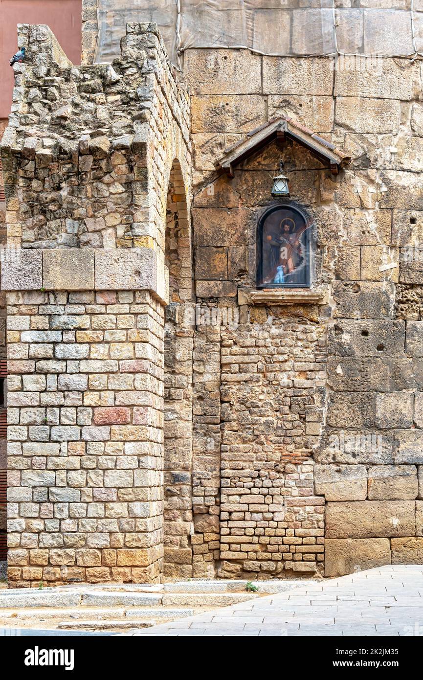 Gothic District. A medieval stone wall with a small image of a Christian religious saint Stock Photo