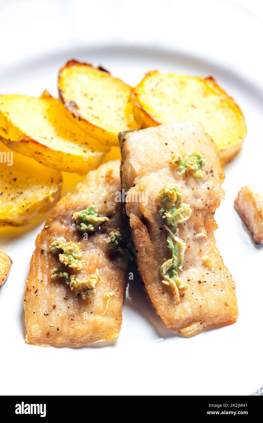salmon fillet with garlic pesto and fried potatoes Stock Photo Alamy