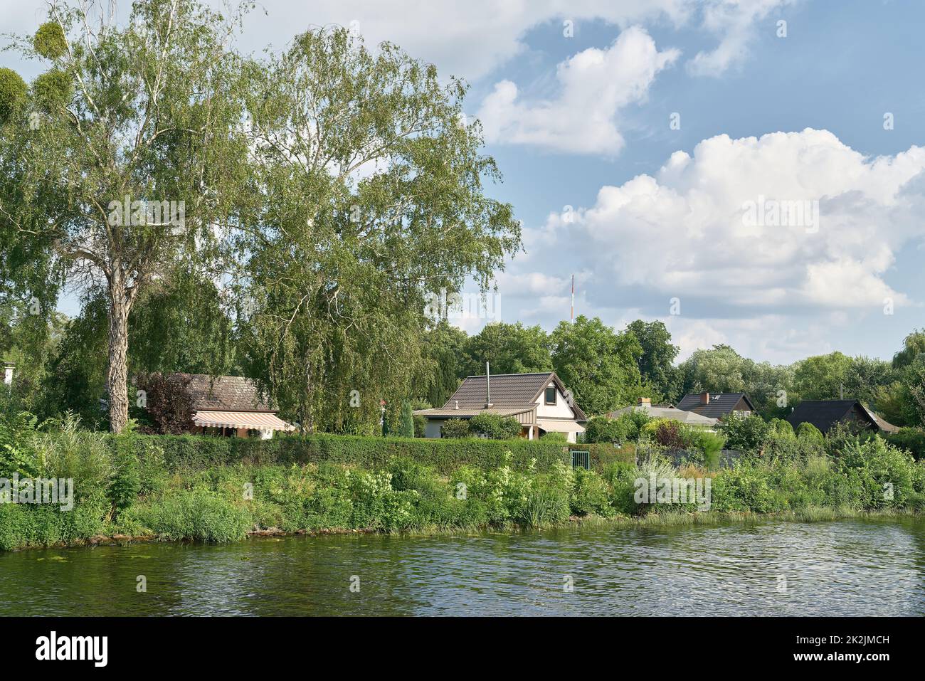 Allotment gardens in Berlin-Spandau romantically located on the banks of the river Havel Stock Photo