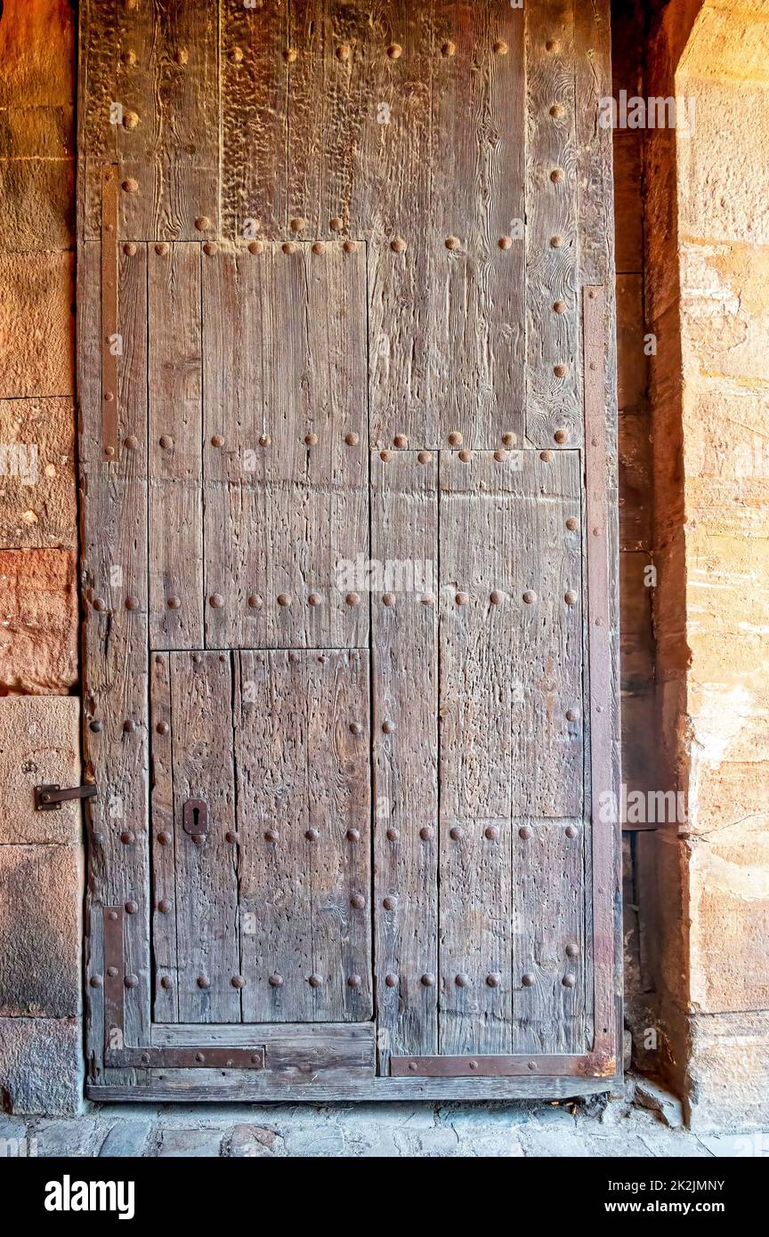 Montjuic Castle or Fort. Front view of a colonial or medieval wooden door. Stock Photo