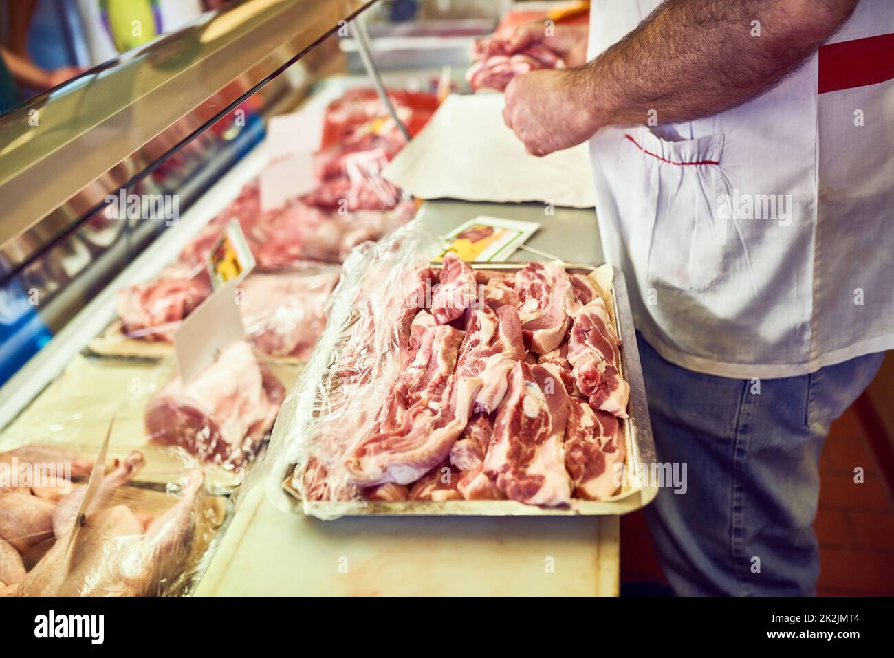 Packed to perfection. Shot of a butcher at his store. Stock Photo