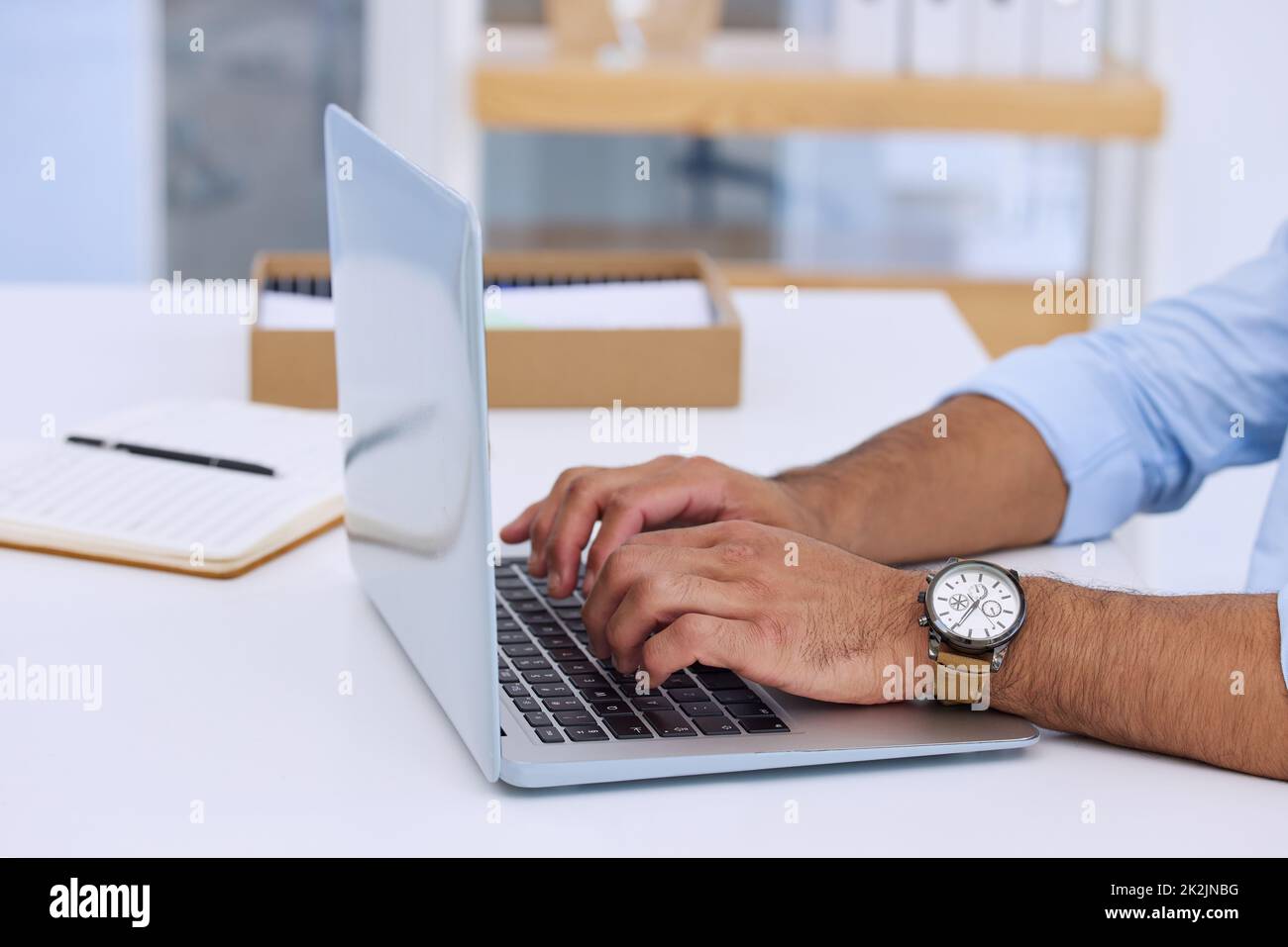 Hoping I get this work out on time. Shot of a businessman typing on his laptop. Stock Photo