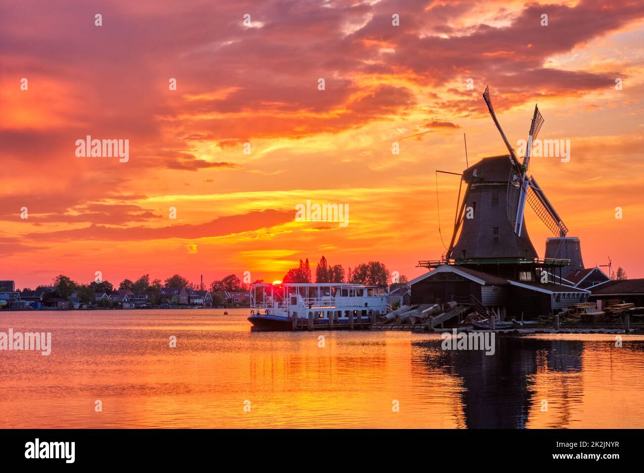 Windmills at Zaanse Schans in Holland on sunset. Zaandam, Nether Stock