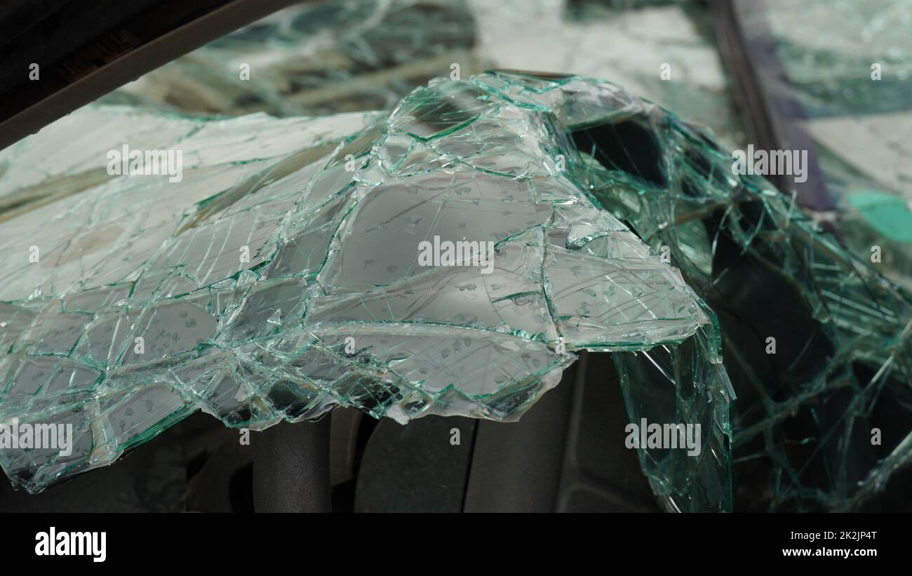 Ð’roken car windshield . Shattered window surface with cracks all over