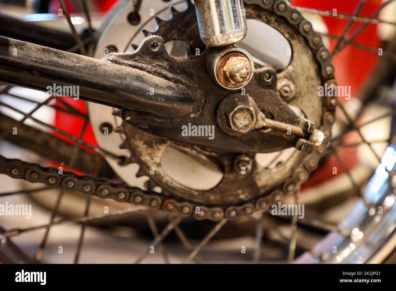 The rear wheel of a motorcycle with the gear for the drive. Stock Photo