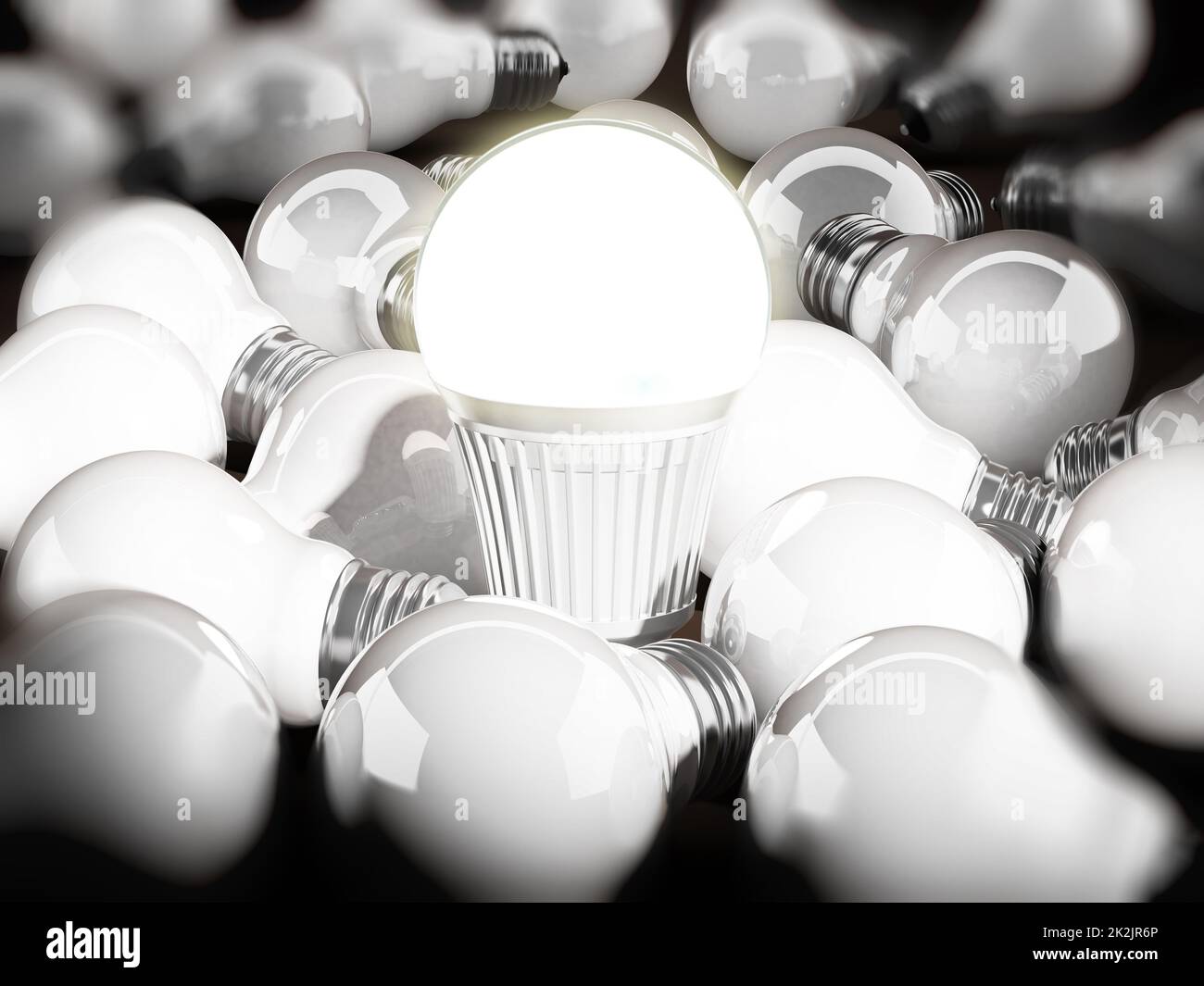 Energy efficient light bulb among standard light bulbs. 3d illustration Stock Photo
