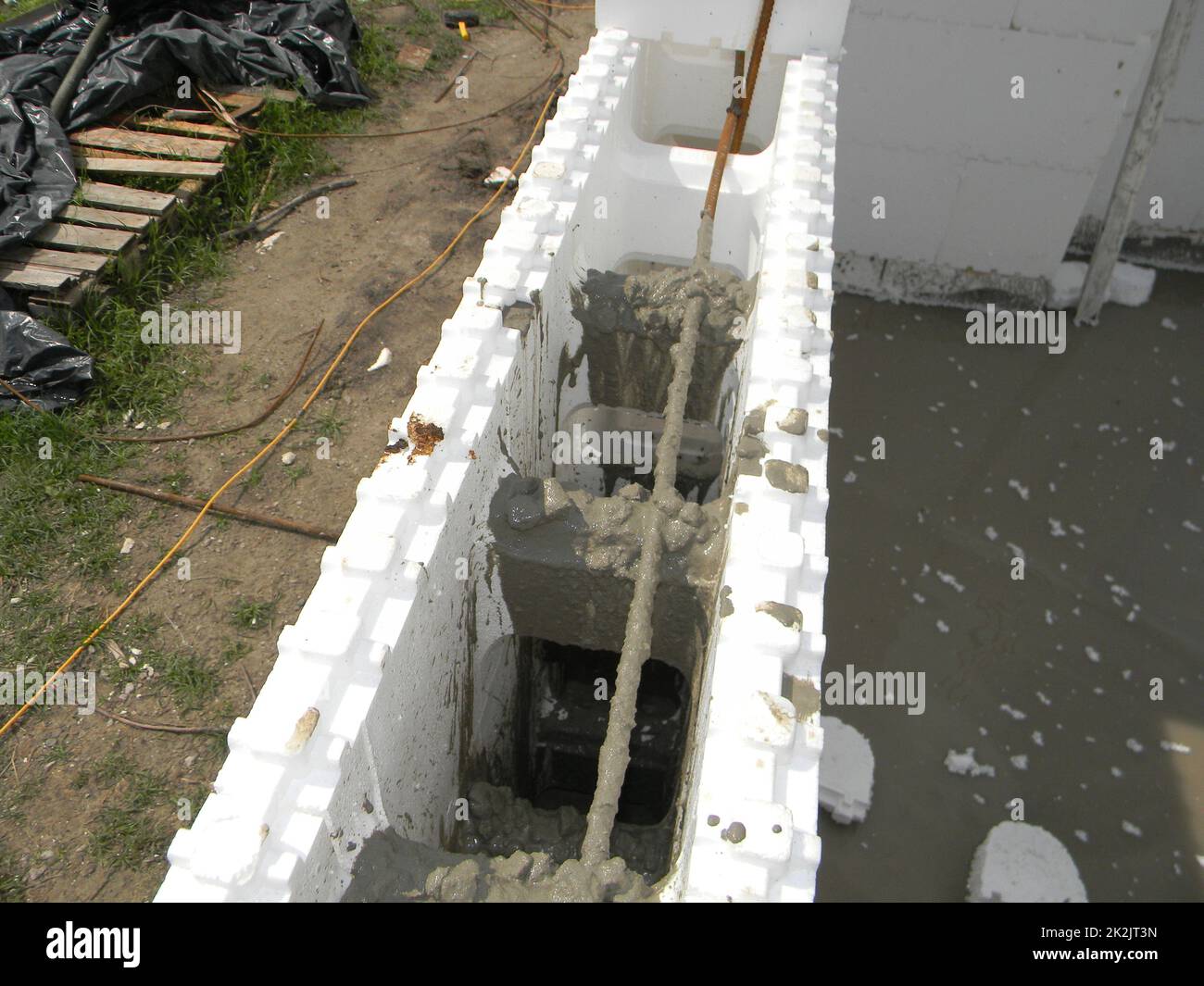 Insulating concrete forms ICF  with reinforced concrete house walls. Insulating concrete forms ICF made of plastic foam that construction crews stack Stock Photo