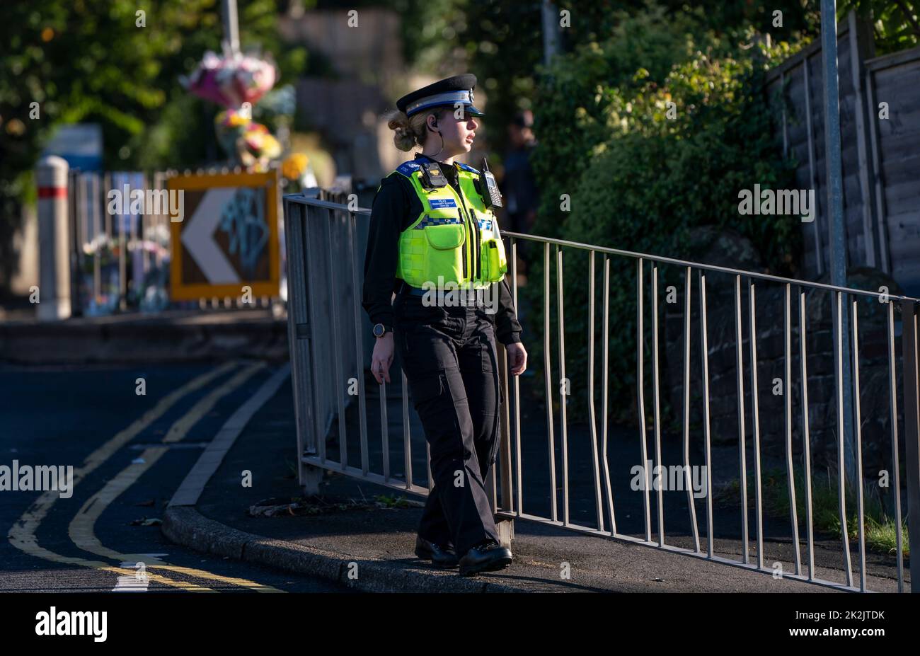 A police community support officer at the scene in Woodhouse Hill, Huddersfield, where 15-year-old schoolboy Khayri McLean was fatally stabbed outside his school gates. Picture date: Friday September 23, 2022. Stock Photo