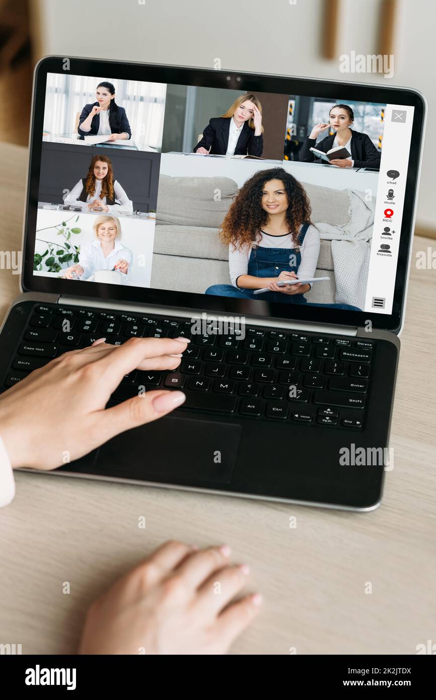 Video conference. Remote business. Telecommuting network. Female coworkers discussing strategy online on laptop screen at virtual office. Stock Photo