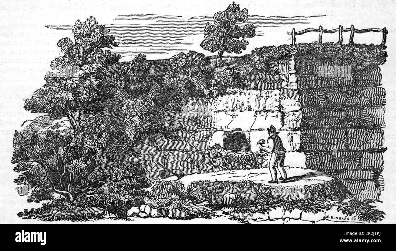 Entrance to Kirdkale Cave, about 25 miles from York, England. Discovered in 1821 when men quarrying in a bank came across the choked-up entrance. From 'The Saturday Magazine' (London, February 1833). Mud covering of the floor was full of bone fragments from tiger, bear, elephant, rhinoceros, etc. which appeared to have be gnawed (by hyenas, it was thought). William Buckland (1784-1856) English geologist and clergyman, examined the remains and concluded that these animals had disappeared from Britain due to some catastrophe, such as the Biblical Flood. Geology. Palaeontology. Stock Photo