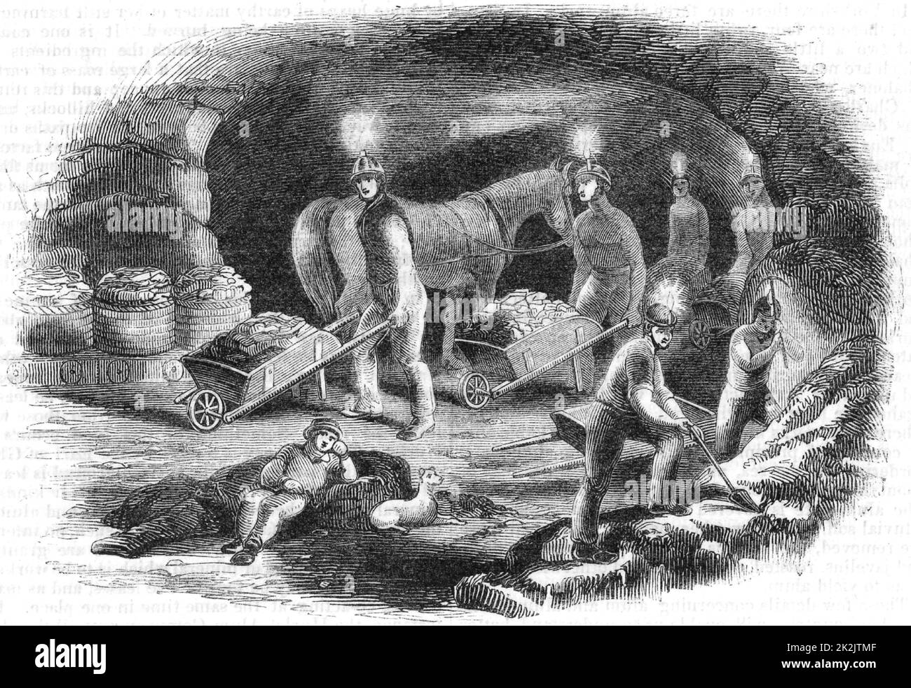 Hurlet alum mine near Glasgow, Scotland, showing miners extracting ore. Light is provided by candles fixed to their helmets. From 'The Penny Magazine' (London, October 1843). Engraving. Stock Photo