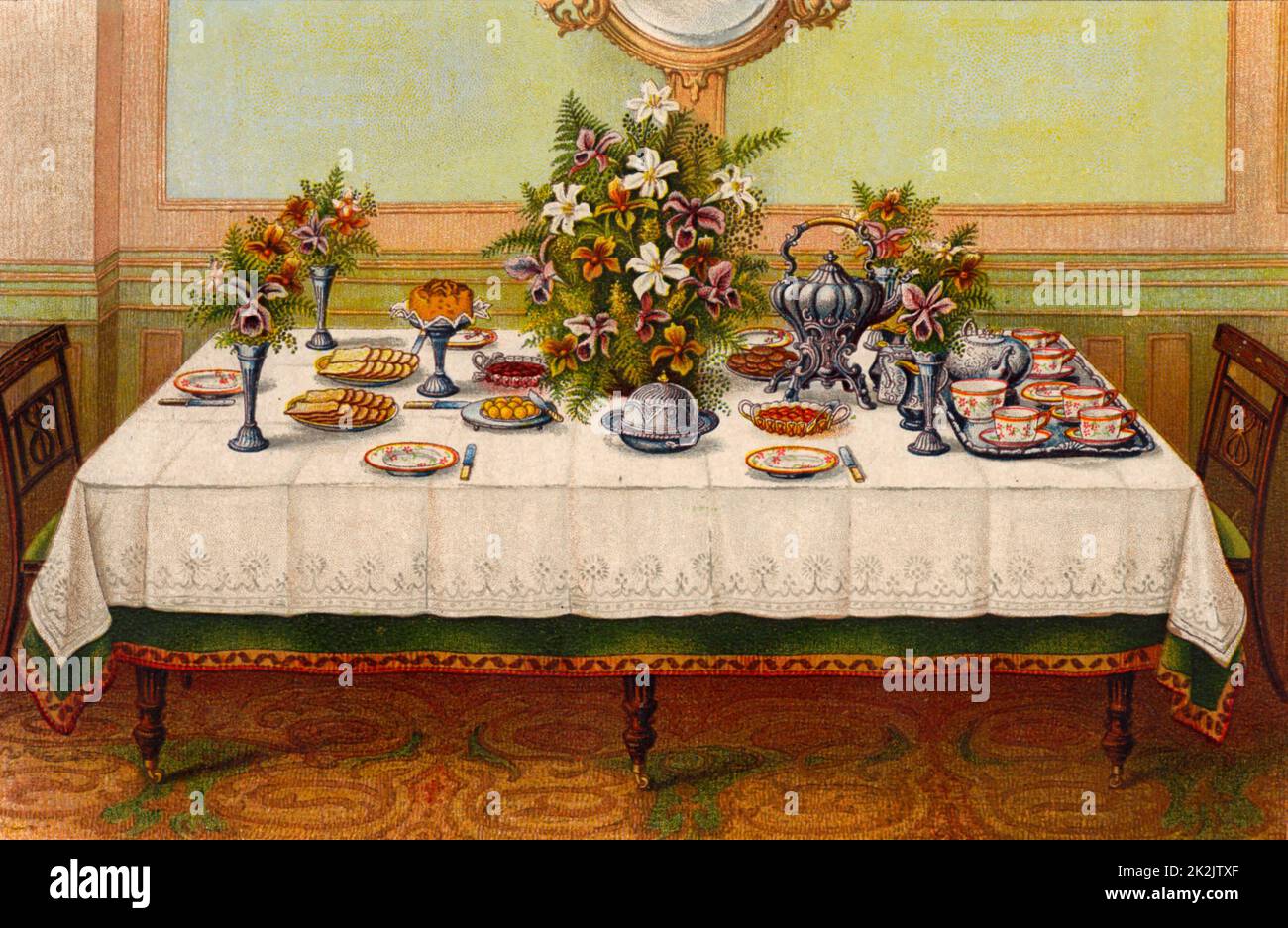 Table covered with a linen cloth and set for Afternoon Tea. A tea kettle on a stand with a spirit heater under it is placed near the teapot. Oleograph from 'Household Management' by Isabella Beeton (London, 1906). Stock Photo