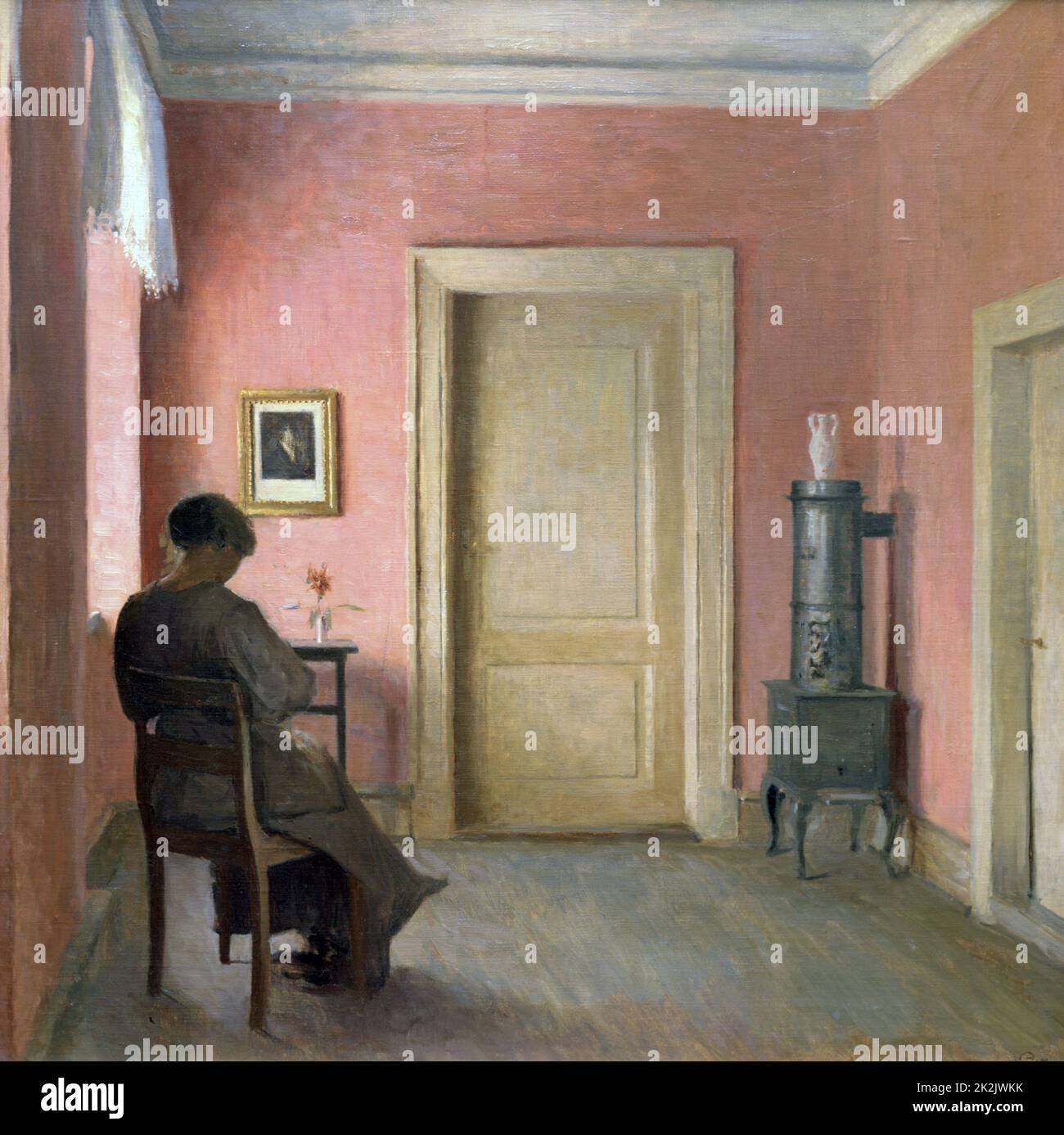 Peter Ilsted Danish school Woman sitting in an Interior 1915 Oil on canvas Private collection Stock Photo