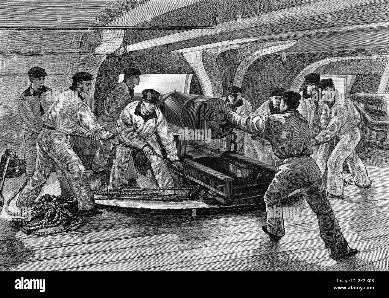 Cadets at the Ecole Navale, the French Naval Academy practicing handling naval cannon below decks of a warship. From 'Le Journal de la Jeunesse' (Paris, c1870). Engraving. Stock Photo