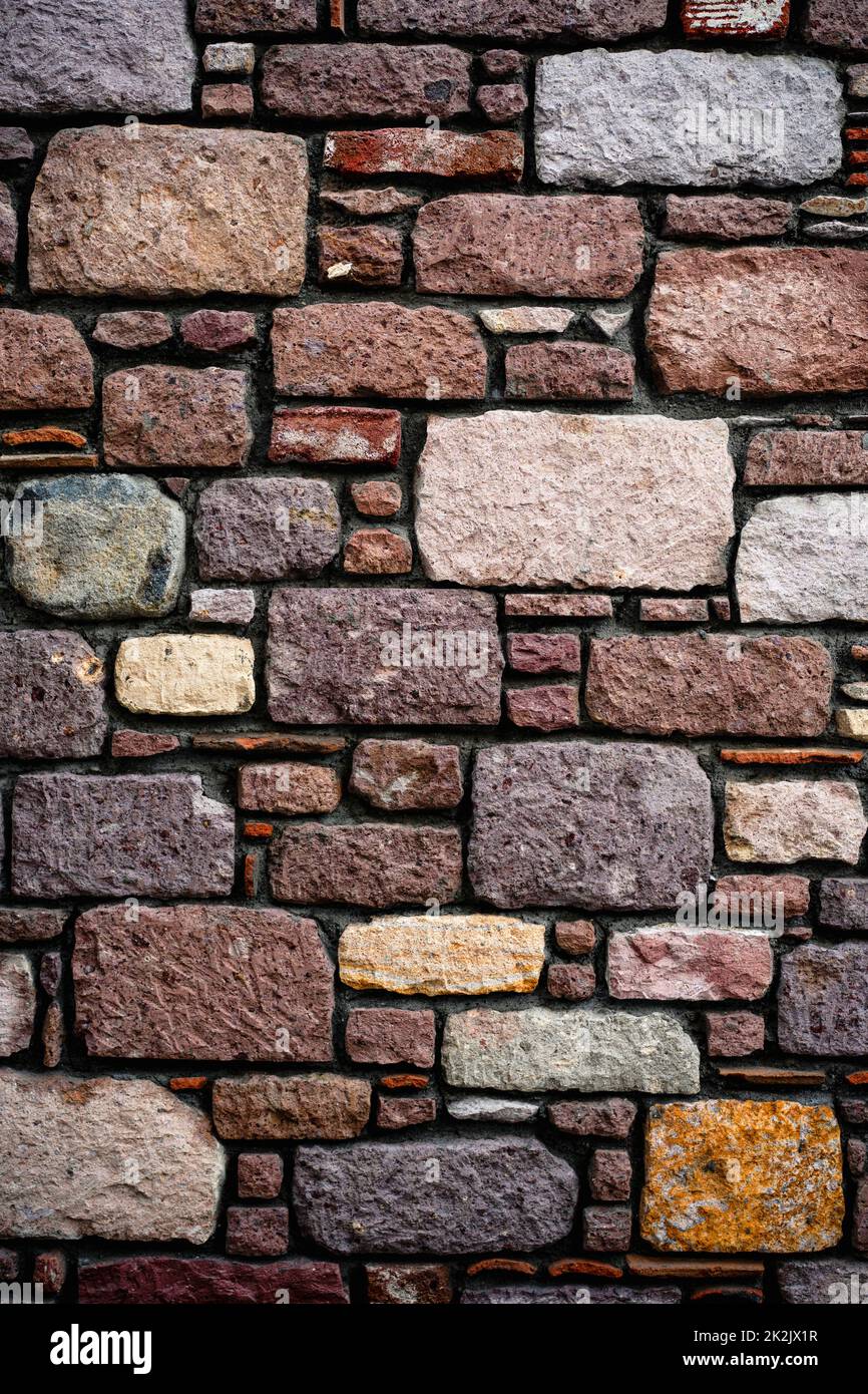 Vertical shot of stone tiles wall, background, texture, pattern. Stock Photo