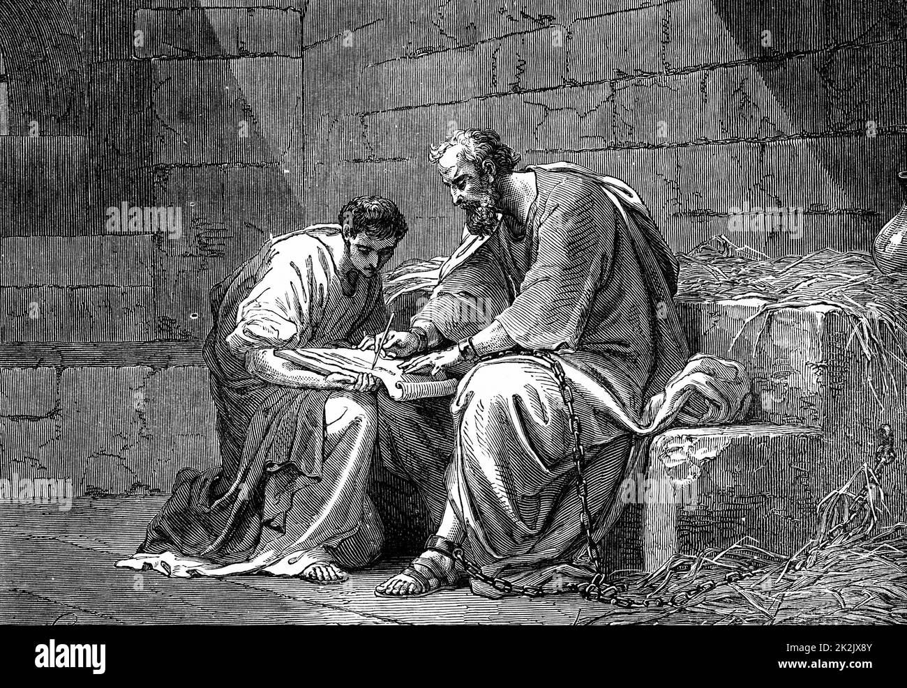 St Paul the Apostle in prison, writing his epistle to the Ephesians. 1st century AD. 'Bible' Ephesians 3.1. 19th century wood engraving Stock Photo